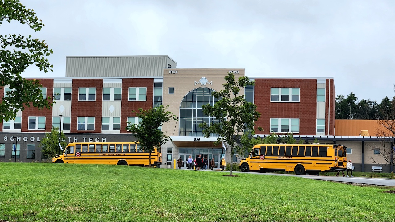 School building with buses
